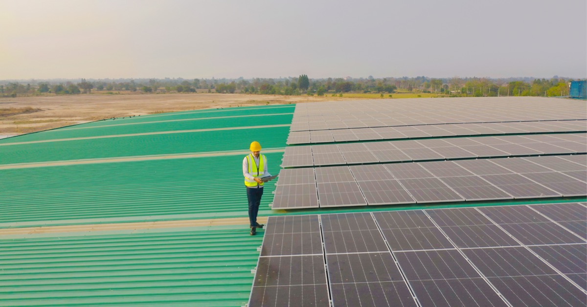 aerial-top-view-of-engineer-man-or-workerpeople-with-solar-panels-or-picture-id1310743276.jpg